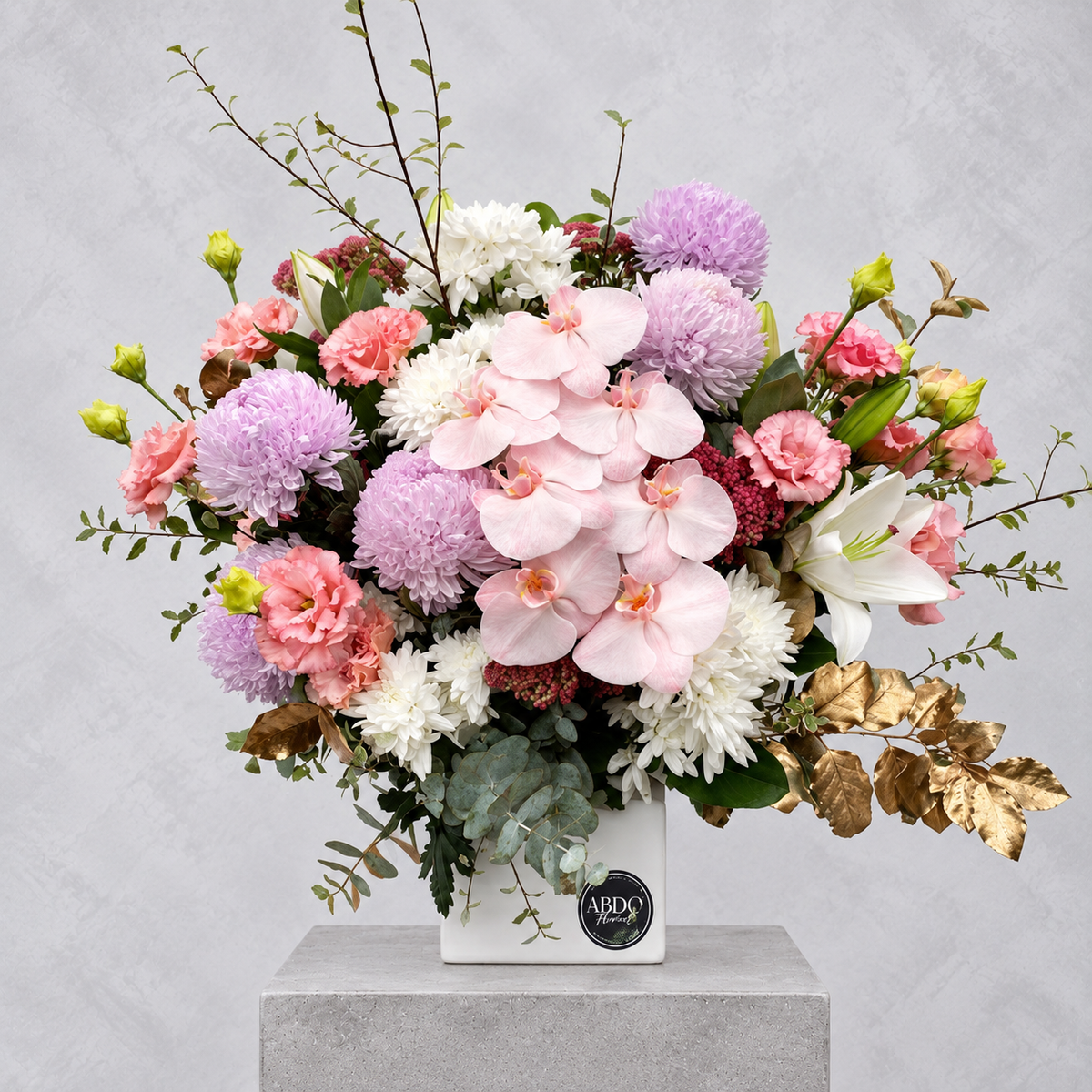 Pastel mixed blooms in a ceramic vase, by Abdo Florist Sydney