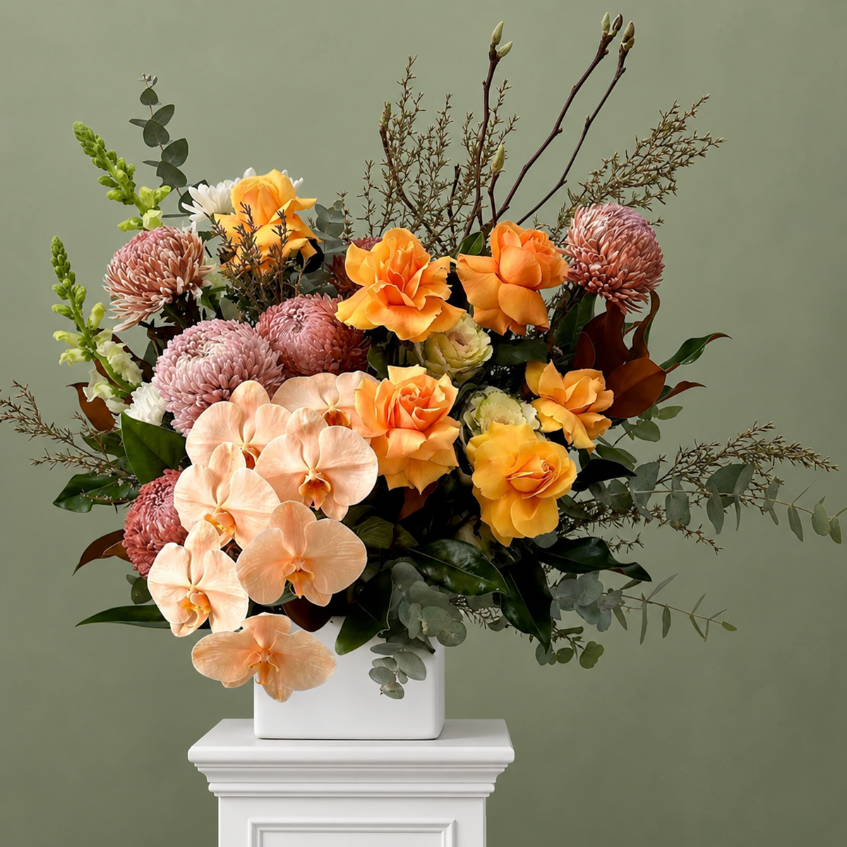 Soft apricot arrangement with orchid stems, by Abdo Florist Sydney